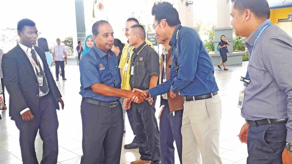 M Kula Segaran (second left) being greeted upon his arrival at ILP Miri.